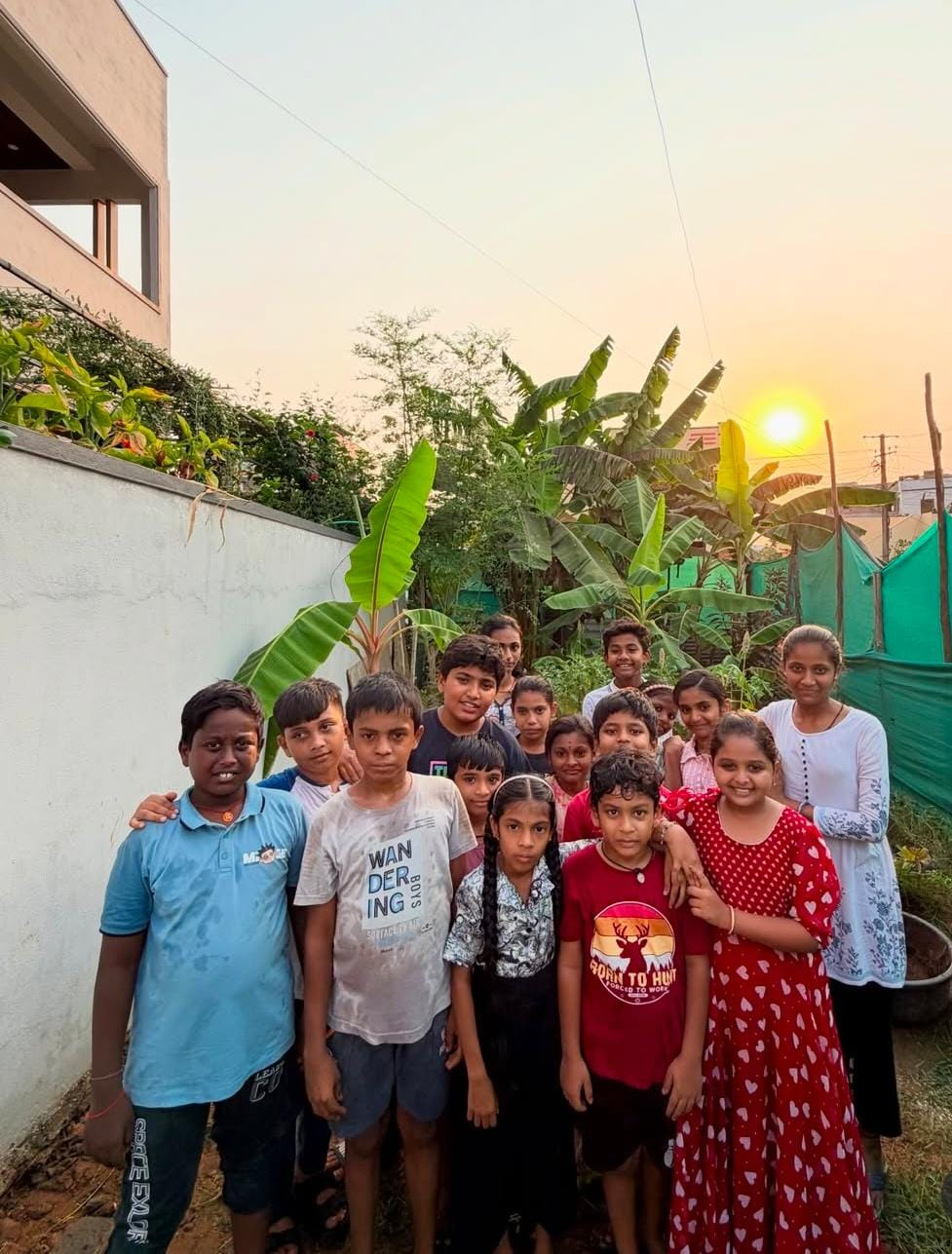 D Academy students gathered together outdoors at sunset