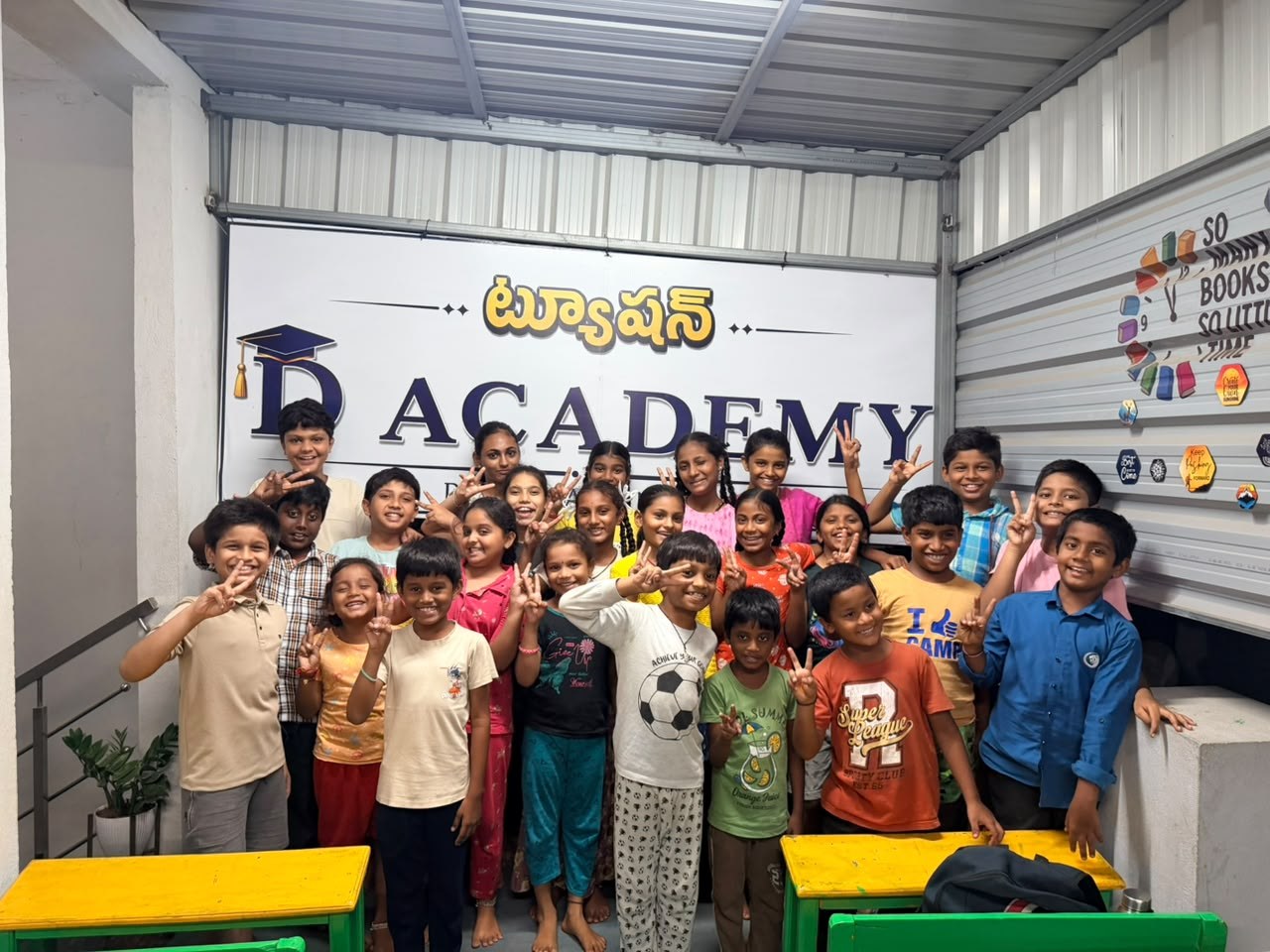 Students of D Academy, Nellore, smiling together in front of the academy signboard